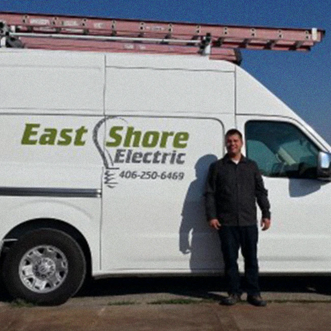 east shore electrics owner in front of a van kalispell mt